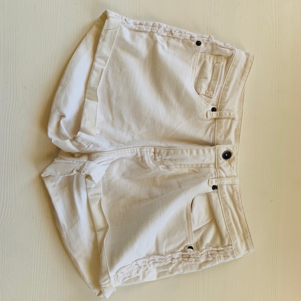 White shorts with floral detail